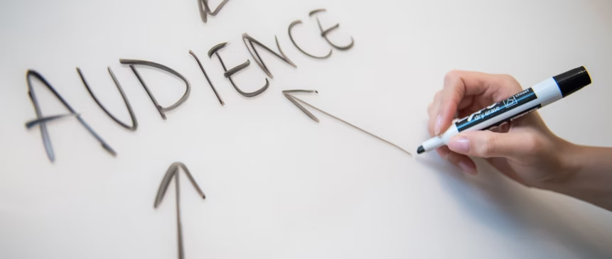 person writing on whiteboard